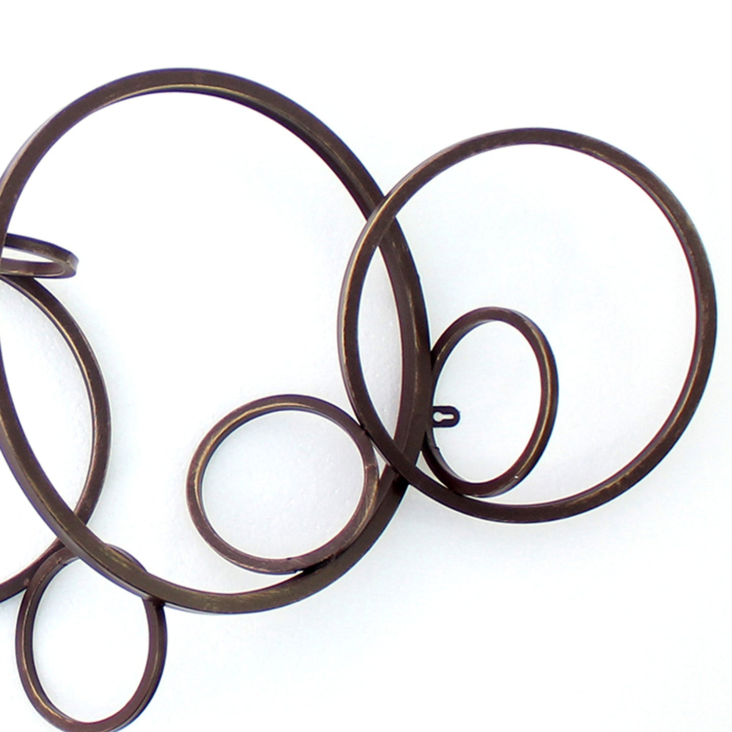 Industrial Style Metal Wall Decor With Multiple Circles Bronze