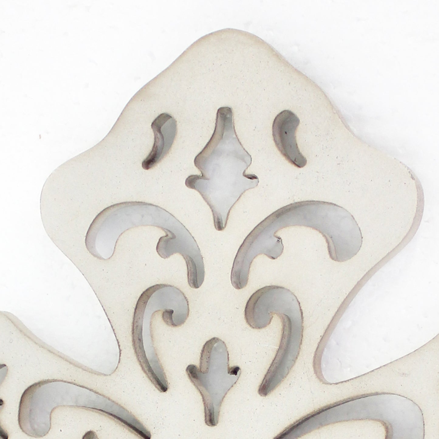 Cross Shaped Wooden Candle Holder With Scrolled Engravings White