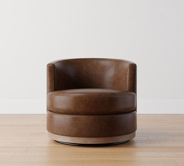 Balboa upholstered leather swivel armchair with barrel back and wood base in brown